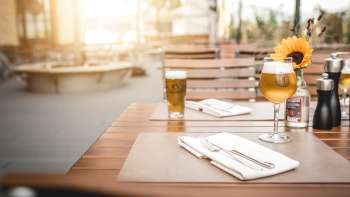 Modern guest rooms with elegant wooden tables, creative lamps and a cozy atmosphere