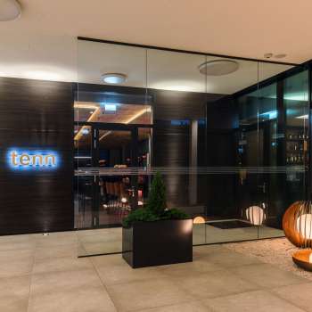 Exterior view of the bar and restaurant lounge with modern architecture and stylish entrance area.
