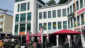 Exterior view of Balu bakery and confectionery in Liechtenstein with a cozy guest garden