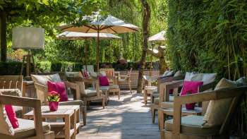 The terrace at the Park Hotel Sonnenhof, featuring cozy armchairs