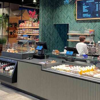 Modern bar with digital display board and delicious snacks