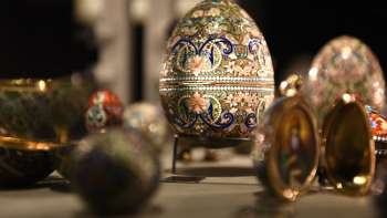 Close-up of ornately decorated Fabergé eggs in a display case at the Liechtenstein TreasureChamber