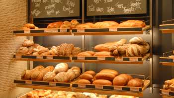Shelf filled with breads and other delicacies in the Amann bakery and confectionery