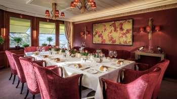 Table set with fine china, glasses and napkins under natural light