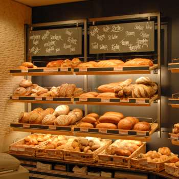 Shelf filled with breads and other delicacies in the Amann bakery and confectionery