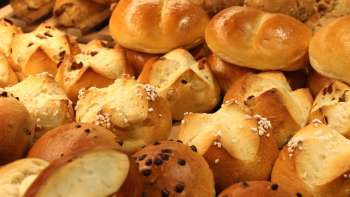 Freshly baked bread rolls and sweet pastries on display at the Balu bakery