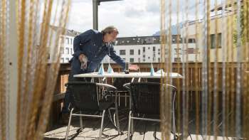 Secluded terrace area in the Made in Italy restaurant with privacy screen and city view.