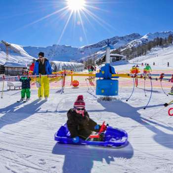 Sunny winter day in Malbi Park - fun, games and tobogganing fun for the whole family