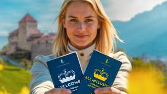 Frau presents the WELCOME and ALL INCLUSIVE Adventure Pass in front of Vaduz Castle