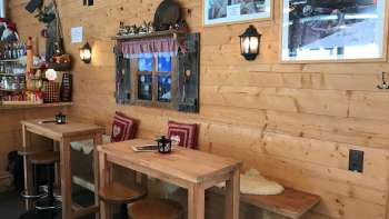 Cozy, alpine-style bar with hut flair