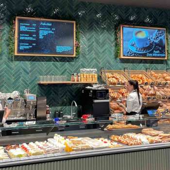 Interior view of the bakery with a well-stocked range and friendly atmosphere