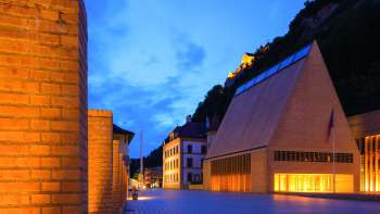 Illuminated parliament building in Vaduz