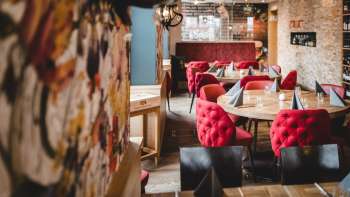 Wide-angle shot of the PUR Restaurant & Bar with its inviting ambience and loving attention to detail.