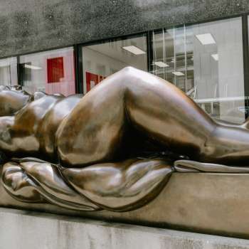 Bronze sculpture of a reclining woman in front of the Liechtenstein Art Museum in Vaduz.