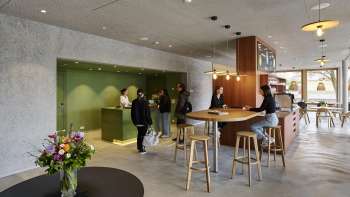 Lobby area with reception and bar at Schaan/Vaduz Youth Hostel