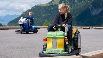 Children drive mini-cars