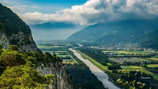 View from Ellhorn in Balzers over the Rhine and the Rhine valley with rocky slopes, the course of the river and far-reaching views of the Alpine region