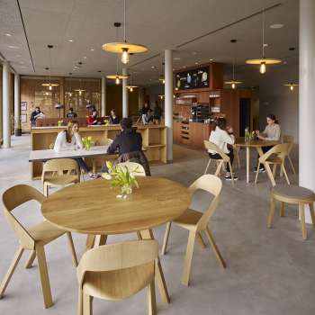 Cozy dining room with wooden furniture at Schaan/Vaduz Youth Hostel