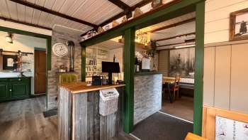 Inviting reception area with loving decoration, wooden elements and traditional ambience in the Bergstübli