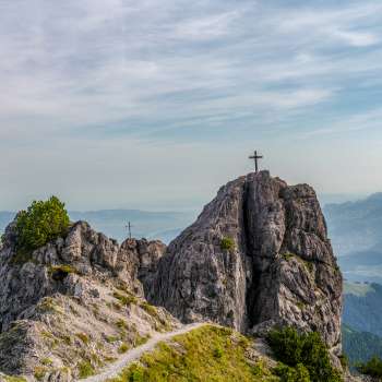 Drei Schwestern mountain chain with two summit crosses and sweeping views over the valley and surrounding mountains