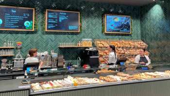 Interior view of the bakery with a well-stocked range and friendly atmosphere