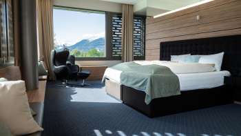Modern double room with a view of the mountains at the Grand Casino Hotel Liechtenstein