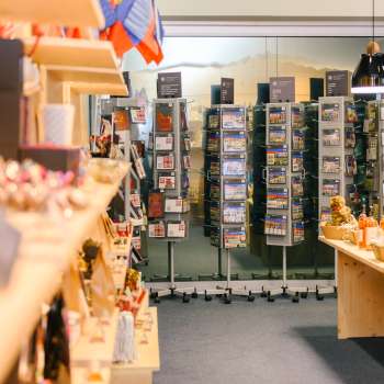 View on postcards and souvenirs in the sales area of the Liechtenstein Center in Vaduz.