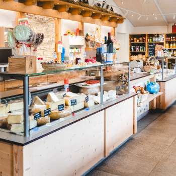 Modern sales room of the Bangshof farm store in Liechtenstein with regional products such as cheese, yogurt and fruit.