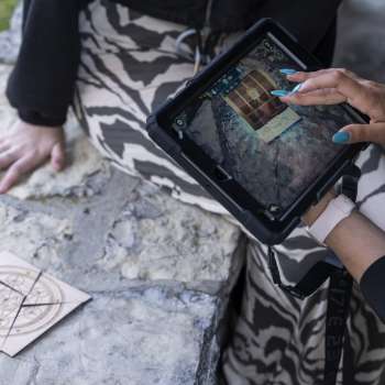 Player uses iPad to solve puzzles in the Outdoor Adventure Room