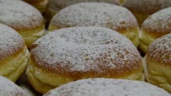 Close-up of doughnuts with powdered sugar 