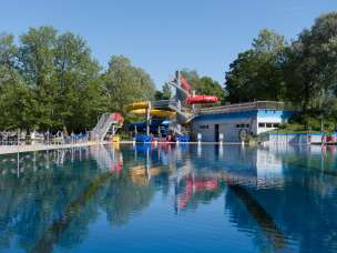 Swimming pool with water slides and bathhouse at the Mühleholz outdoor pool in Vaduz
