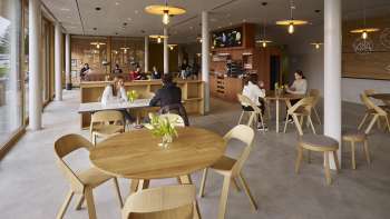 Cozy dining room with wooden furniture at the Schaan-Vaduz Youth Hostel