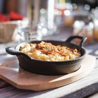 Cheese dumplings with fried onions at the Gafadura hut in Liechtenstein - regional specialty in an alpine setting
