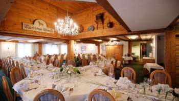 Cozy dining room with bar area, rustic furnishings and inviting atmosphere