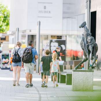 People are strolling through the old town of Vaduz