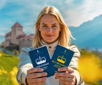 Frau presents the WELCOME and ALL INCLUSIVE Adventure Pass in front of Vaduz Castle