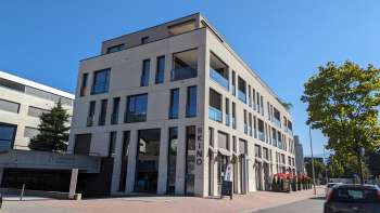 Exterior view of the Skino by day with a blue sky in the background