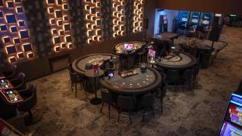 View of the interior of the Casino Admiral Triesen with various gaming tables 