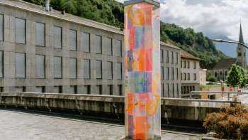 Colorful anniversary stele in Vaduz with bright ornaments, designed by artist Evelyne Bermann.