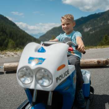 Child drives a mini-car