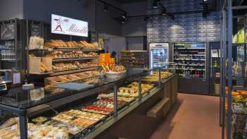 Freshly baked breads, cakes and pastries in the modern Mündle bakery in Ruggell with an inviting sales counter