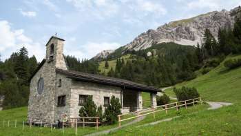 Peace chapel with mountain landscape in the background Peace chapel with mountain landscape in the background
