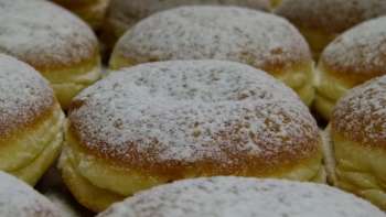 Close-up of doughnuts with powdered sugar 
