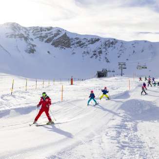 Children learn to ski in a playful way at the Malbun ski school in Liechtenstein - supervised by experienced ski instructors in the family-friendly ski area.
