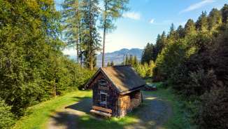 Rustic Paula hut in the middle of the forest near Triesenberg with a view of the Rhine Valley - an ideal resting place when hiking or biking.