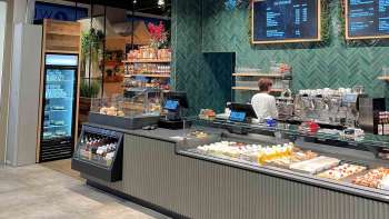 Modern bar with digital display board and delicious snacks