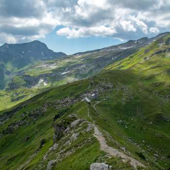 Panoramic view over the Pfälzerhütte hut the Liechtenstein Alps with dramatic cloud formations.