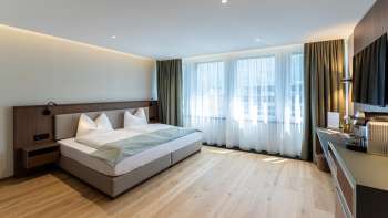 A modern and cozy double room at the Alpin Royal Hotel
