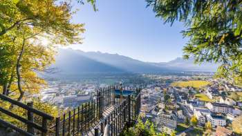 View from the panoramic terrace over the sunny Rhine Valley and the town of Vaduz.