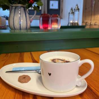 Close-up of a coffee cup on a table in the Bergstübli Steg